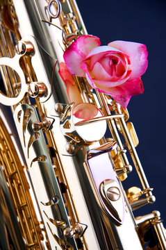 Saxophone and Pink Rose on Blue