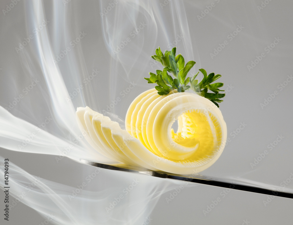 Poster butter curl on a knife and steam