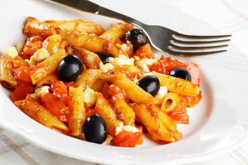 Pasta with tomato sauce and olives