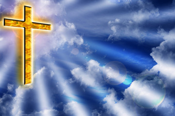 Golden cross in cloudy blue sky