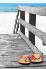 Flip flops on beach walkway