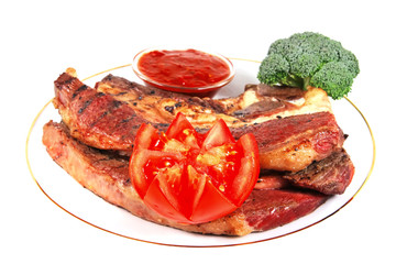 roast steak served with vegetables