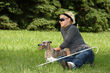 blind woman playing with her dog