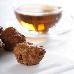 Baked muffins with tea