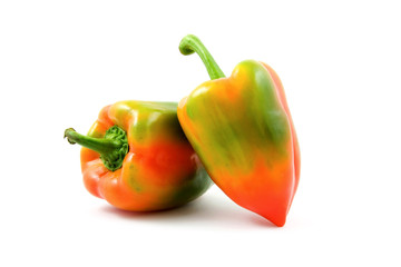 orange/ green paprika isolated on white background