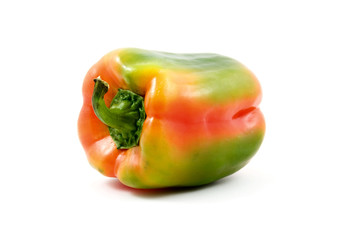 orange/green paprika isolated on white background