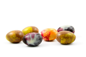 colorful chocolate eggs isolated on white background