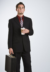 Attractive man with coffee and briefcase