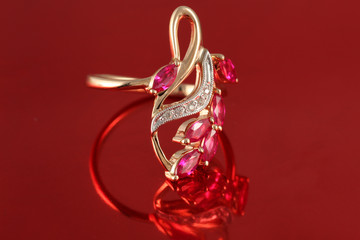 golden ring with diamonds and ruby