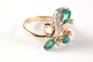golden ring with diamonds and emerald