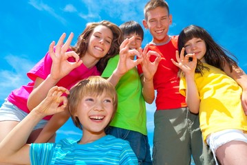 Children showing ok sign