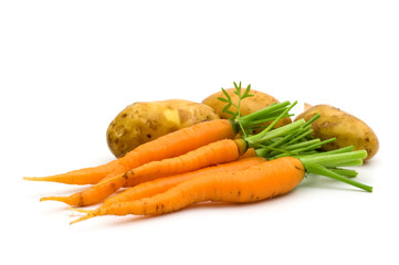 young potatoes and carrots on white background