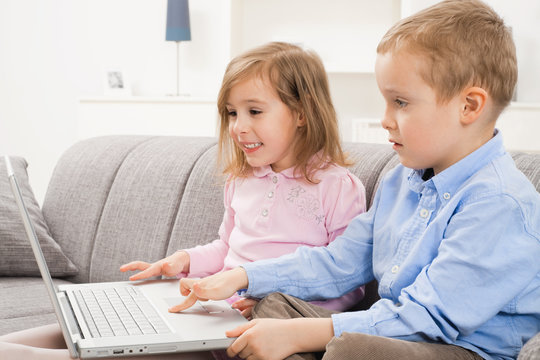 Happy children with laptop