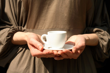 Girl with a cup of hot drink