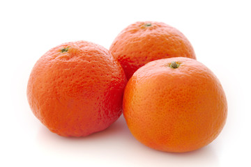 Three ripe mandarines