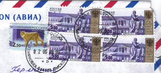 Edge of an envelope with postage stamps