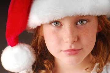 Fototapeta premium Young girl in santa cap