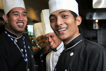 group of chef smiling at work