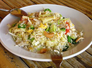 Fototapeta na wymiar Thai-style fried rice with cashew and pineapple