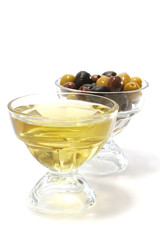 olive oil with green, black and brown olives