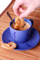 Cup of coffee with milk and cookies