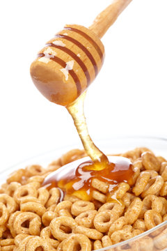 Pouring Honey On Cornflakes