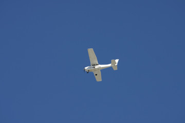 White Plane From Below on Blue
