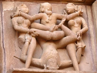 Stone carved erotic sculptures in hindu Khajuraho temple, India © Lukas Hlavac