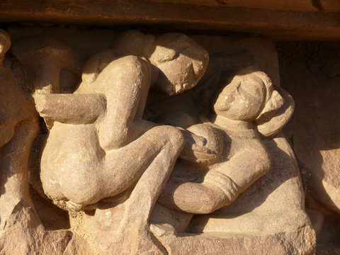 Stone carved erotic sculptures in hindu Khajuraho temple, India