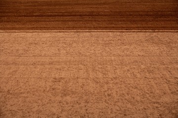 Ploughed red clay soil agriculture fields