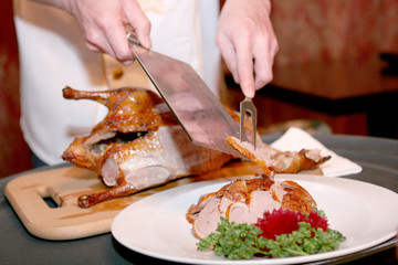 Chef cutting duck in chineese restaurant