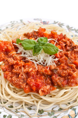 Spaghetti bolognese with cheese and basil