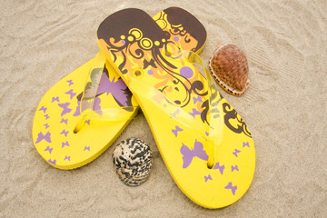 yellow slippers on beach