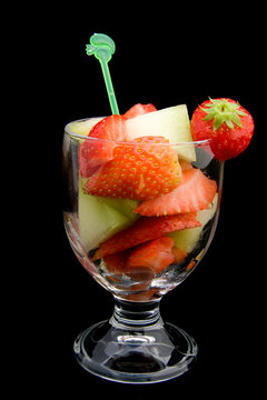 fruit cocktail isolated on black background