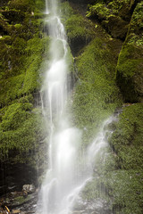 Waterfall with mossy rocks