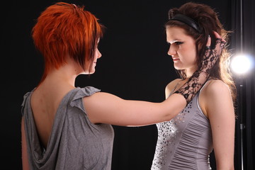 Two models in colorful setting in the studio