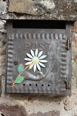 Rustic metal box with flower