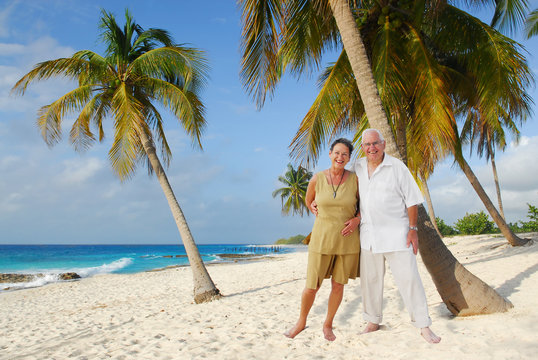 Happy European Seniors On Tropical Beach In Cuba