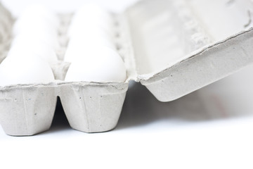 Closeup of an open carton of eggs