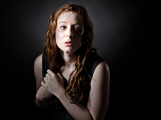 Powerful Low Key Shot of a Scared Red Headed Teen