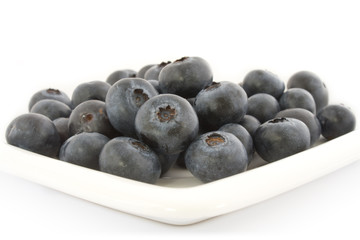 A plate with fresh blueberries