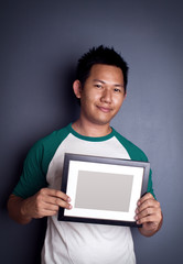 Man holding picture frame