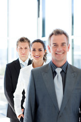 Young businesswoman in focus with her team