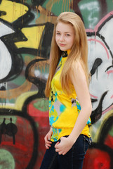 Fototapeta na wymiar female teenager with graffiti background