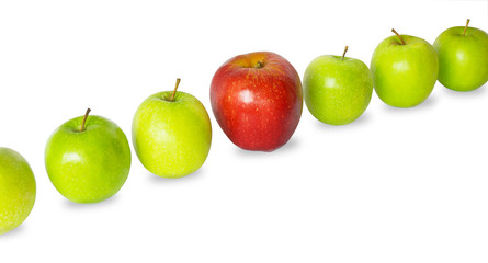 Row of green apples with red one. Standing out concept.