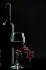 Red wine and grapes