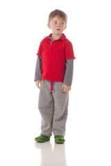 Cute young blond boy on white