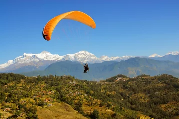 Washable wall murals Nepal paragliding with himalaya view in nepal