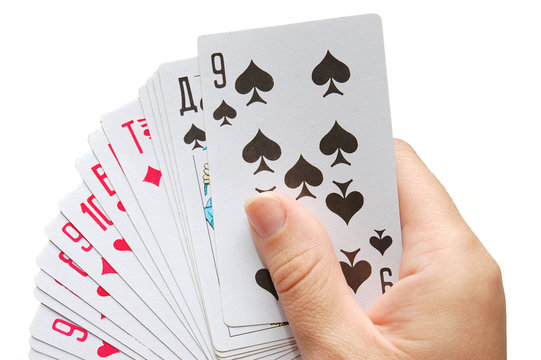 playing card in hand on white background
