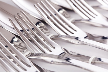 Close up of flatware forks isolated on white background